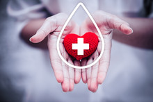 Hand Giving Red Heart For Help Blood Donation Hospital Or Healthcare Concept.