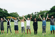 © Rawpixel.com - Happy diverse people holding hands in the park