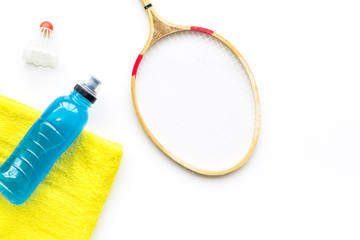 Sticker - Badminton training concept. Badminton racket, shuttlecock, sport drink and towel on white background top view copy space