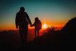 © nadezhda1906 - father and little daughter travel in mountains at sunset