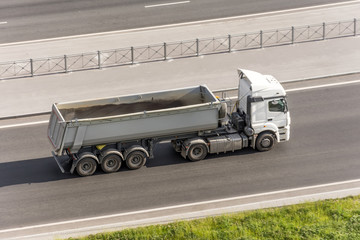 Wall Mural - Truck with a trailer for bulk driving on the highway