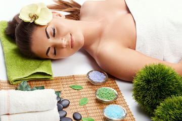 Spa. Face massage. Beautiful woman in spa salon.Young female with clean fresh skin. Skin and body care girl. Facial beauty treatment. healthy lifestyle and relaxation concept. Cosmetology.Relaxing