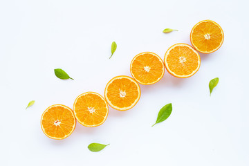 High vitamin C. Fresh orange citrus fruit with leaves isolated on white.