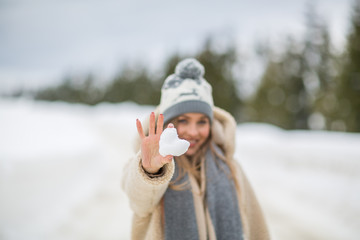 Pretty fashion blonde woman posing in winter session