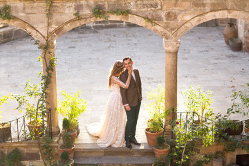 Wall Mural - Beautiful wedding couple posing in old city