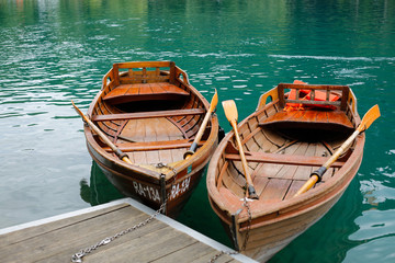 Two boats of wood at the lake