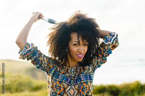 Beautiful Young Woman Using Afro Hair Comb For Styling And