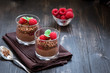 Chocolate dessert in glasses with raspberries