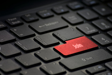 computer keyboard with a red key join