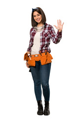 Wall Mural - A full-length shot of a Young worker woman saluting with hand with happy expression over isolated white background