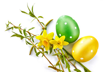 Wall Mural - Easter eggs with spring yellow flowers and branch willow. Top view, isolated on white background.