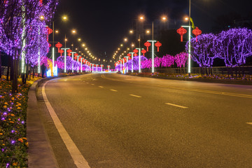 Poster - Highway with Colorful Lights in Spring Festival.abstract image of blur motion of cars on the city road at night,Modern urban architecture in Chongqing, China