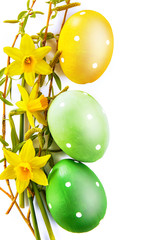 Wall Mural - Easter eggs with spring yellow flowers and branch willow. Top view, isolated on white background.