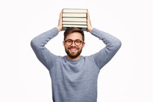 Cheerful Student Holding Books On Head