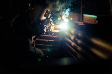 Wall Mural - Welding at the industrial factory for steel production heavy industrial at night