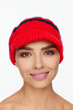 © Andriy Goncharenko - Portrait of an energetic beautiful woman with a red knitted hat on her head