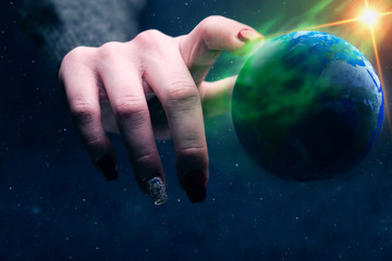 Poster - Woman touching planet with finger. Green Nebula dust in infinite space. Mixed media.