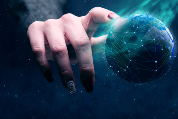 Poster - Woman touching planet with finger and network web and blue nebula dust. Mixed media.