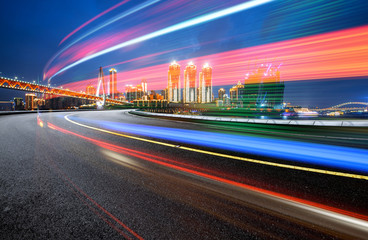 Poster - abstract image of blur motion of cars on the city road at night，Modern urban architecture in Chongqing, China