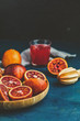 © Victoria Kondysenko - Shorts of alcohol cocktail with Sliced Sicilian Blood oranges and fresh red orange juice