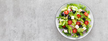 Vegetable Salad With Fresh Cucumber, Tomato, Olive, Onion, Lettuce And Feta Cheese. Healthy Food. Top View. Banner.