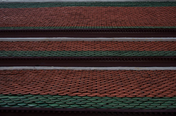 Traditional thai pagoda rooftop tiles in Wat Phra Kaew temple