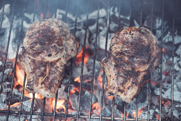 Poster - juicy tasty steaks grilling on barbecue grill grade with smoke