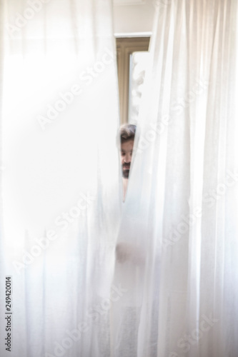 Homme Pere Au Foyer Derriere Les Rideaux Buy This Stock Photo