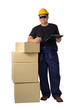 © sirastock - worker in Mechanic Jumpsuit with stack of boxes and Checking Products isolated on white background