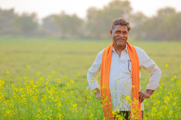 Indian farmer at black musterd field