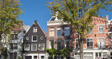 Fototapeta Londyn - exterior of Amsterdam houses on sunny day