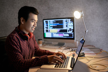 Wall Mural - Programmer working on laptop