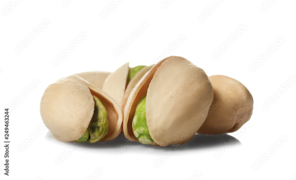 Tasty pistachio nuts on white background