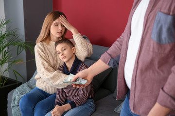 Wall Mural - Man giving alimony to his ex-family at home