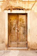 Aged Shabby Wooden Door Of The Typical Old Building In Zadar, Croatia