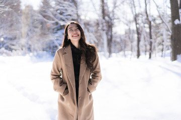 Portrait Young Beautiful asian woman smile happy travel and enjoy with snow winter season