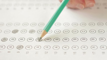 filling out answers on a multiple choice test close up