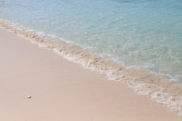 Beautiful sandy beach and soft blue ocean wave