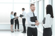 © yurolaitsalbert - handshake of the staff standing in an office hall