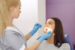 Dentist examining a patient's teeth in the dentist office