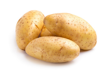 Wall Mural - Fresh potatoes isolated over a white background.
