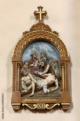 Jesus Christ Est Cloue Sur La Croix Chemin De Croix Xi Eglise Saint Andre Dommancy Jesus Christ Is Nailed To The Cross Path Cross Xi St Andrew S Church Domancy Stock Photo Adobe