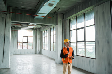 young asian engineer doing inspection on project installation