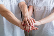 © golubovy - Volunteer couple. Unity and teamwork concept. Man and woman putting hands together.