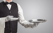 © ra2 studio - Waiter serving with white gloves and steel tray in an empty space