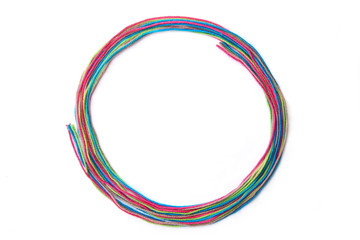 Wall Mural - colorful circle frame made of thread isolated on white background. empty frame of cotton thread.
