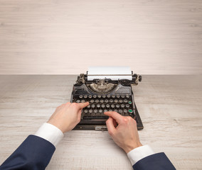 First person perspective elegant hand writing on an oldschool typewriter with copyspace
