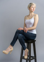 Girl On Chair With Crossed Legs Studio Snapshot