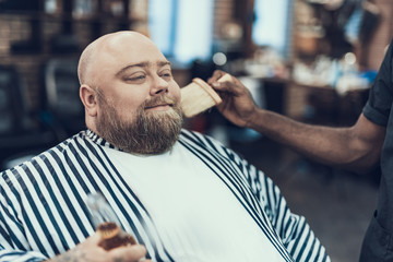 Sticker - Attractive man enjoying ending on hair cutting