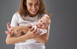 © Yakobchuk Olena - Pretty mom looking at her baby and smiling wide